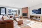 Large living room area with views of the slopes